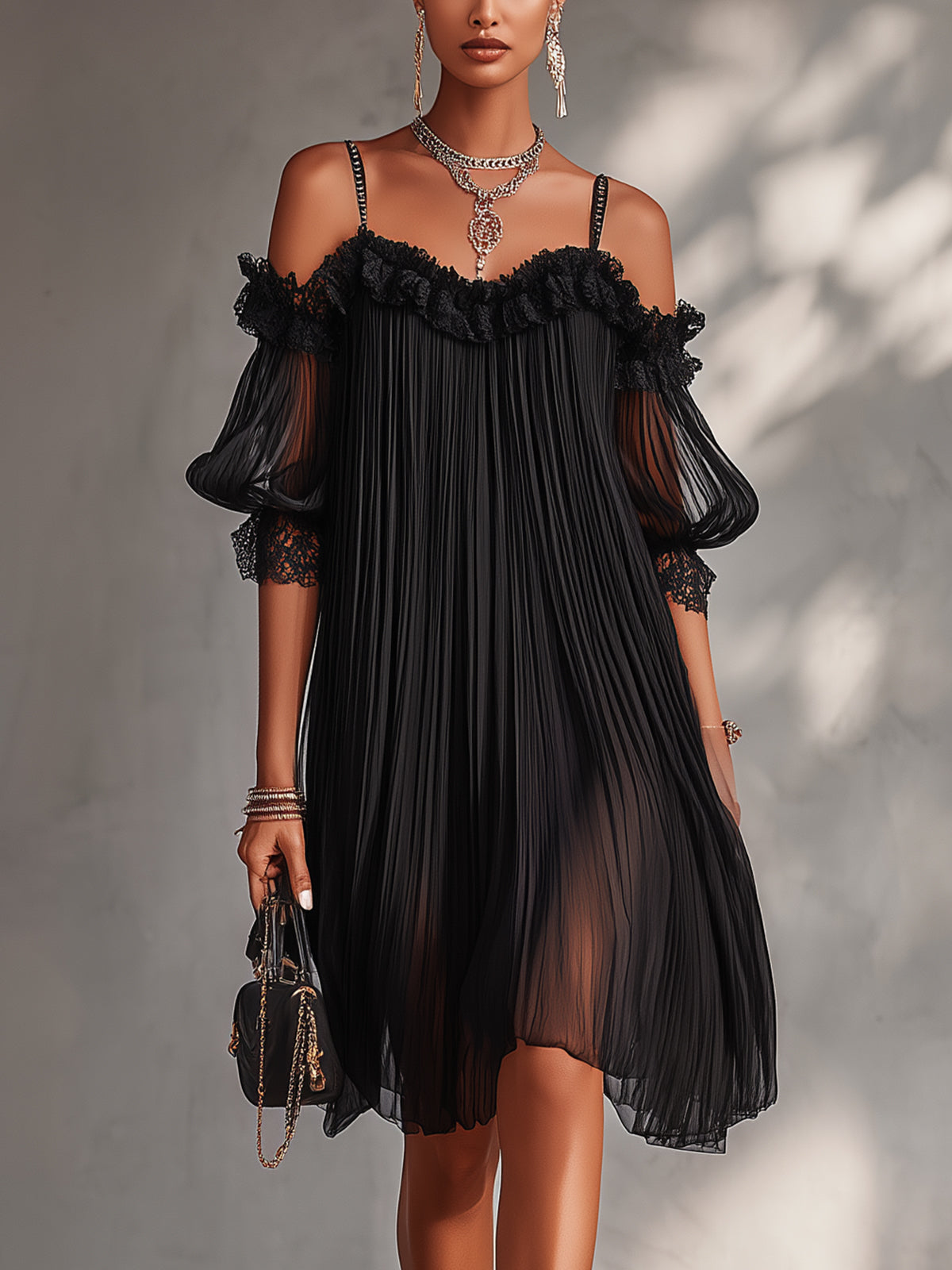 Bruma | Vestido negro plisado de gasa con hombros descubiertos y mangas abullonadas