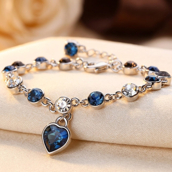 Pulsera de cadena con corazón de zafiro plateada