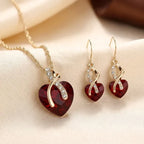 Conjunto de joyas de corazón trenzado de oro y rubí
