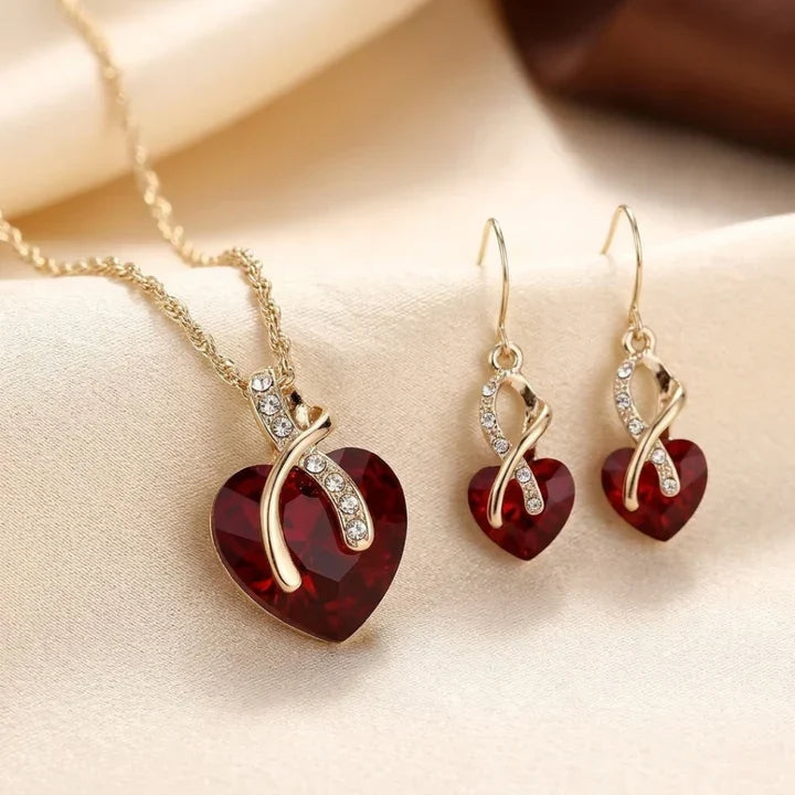 Conjunto de joyas de corazón trenzado de oro y rubí