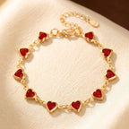 Pulsera de cadena con corazón de rubí dorada